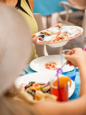 around-dinner-table-taking-food-white-plate